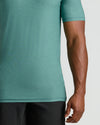 Evergreen Tall Active Crew Neck 2.0 on muscular arm and torso.