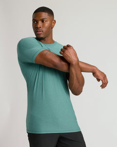 True ClassicEvergreen Tall Active Crew Neck 2.0 on athletic model stretching.