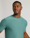 Evergreen Tall Active Crew Neck 2.0 on young man, contemplative expression.