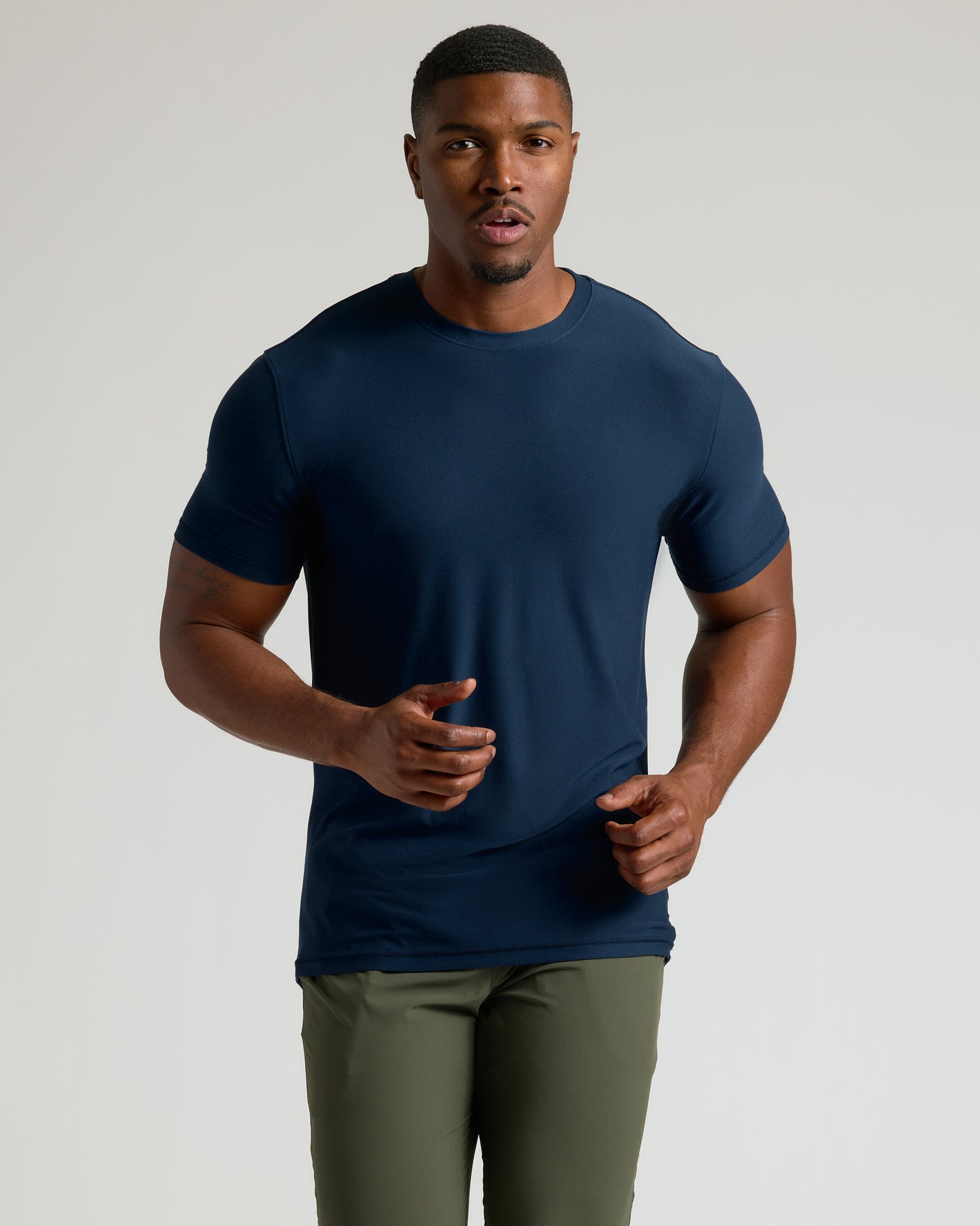 Navy Tall Active Crew Neck 2.0 worn by athletic man jogging.