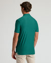 Back view of Clover Short Sleeve Tall Active Polo worn by man.