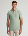 Young man wearing Limited Spring Tall Active Polo in light green.