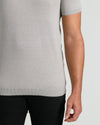 Heather Gray Tall Dressy Polo on person, highlighting ribbed hem and freckled arm.