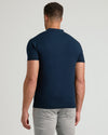 Back view of man in Navy Tall Dressy Polo and light trousers.