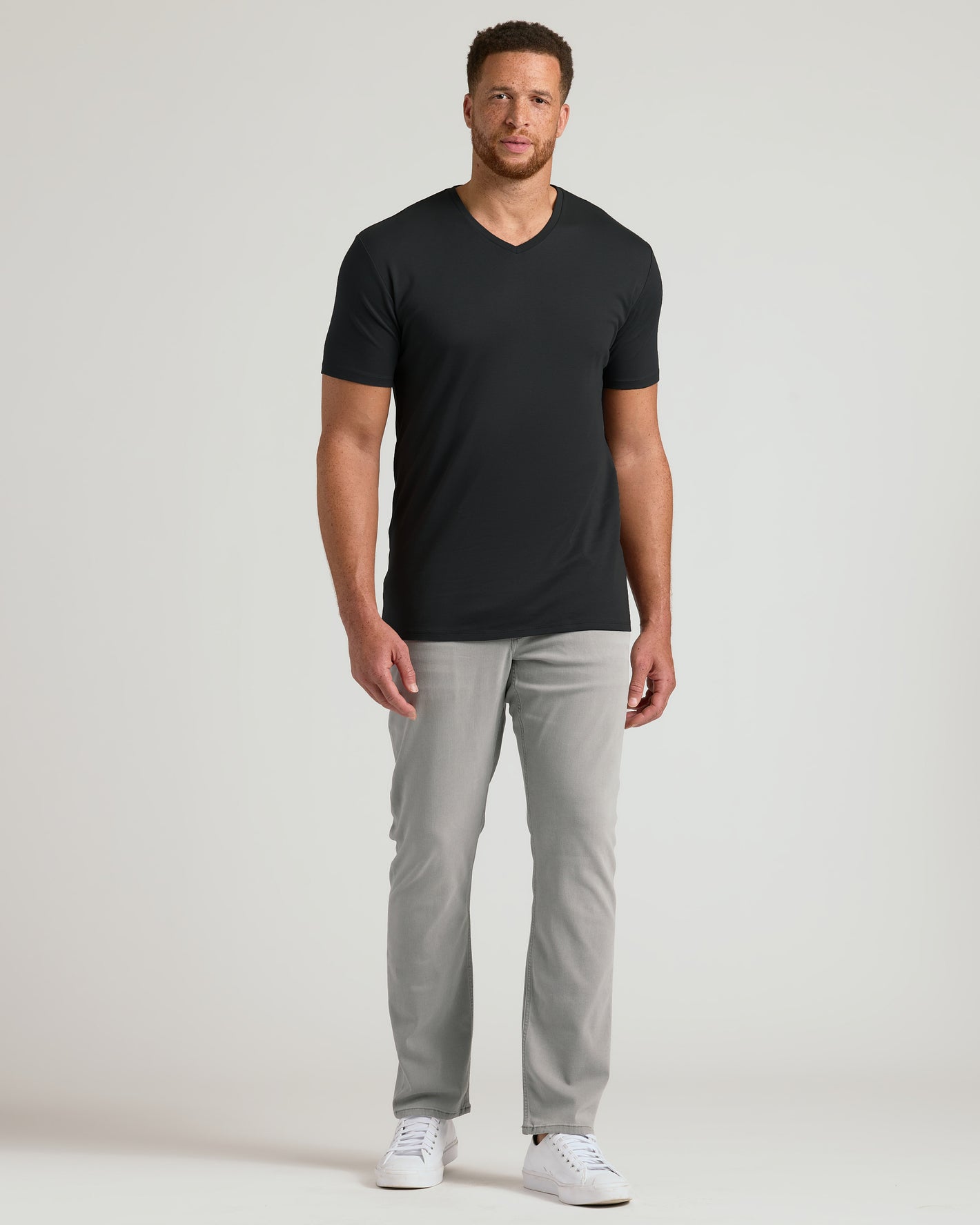 Black Tall Premium Pima V-Neck on man with slim-fit jeans.