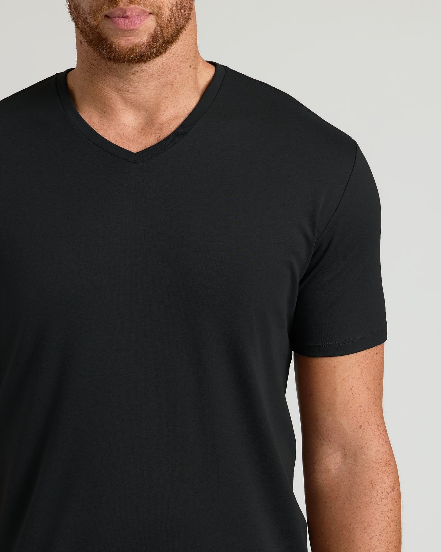 Black Tall Premium Pima V-Neck T-shirt worn by person, showcasing tailored fit.
