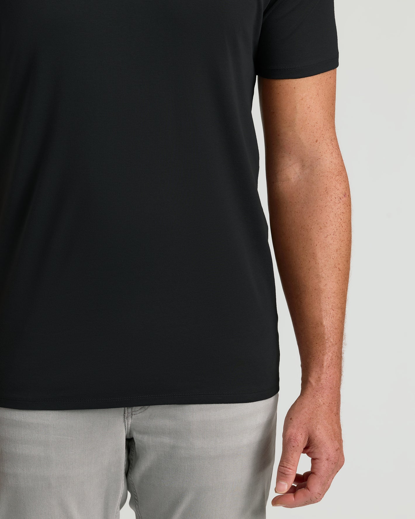 Black Tall Premium Pima V-Neck on person, freckled arm visible.