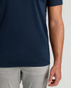 Tall Premium Pima V-Neck in navy, tucked over gray trousers.