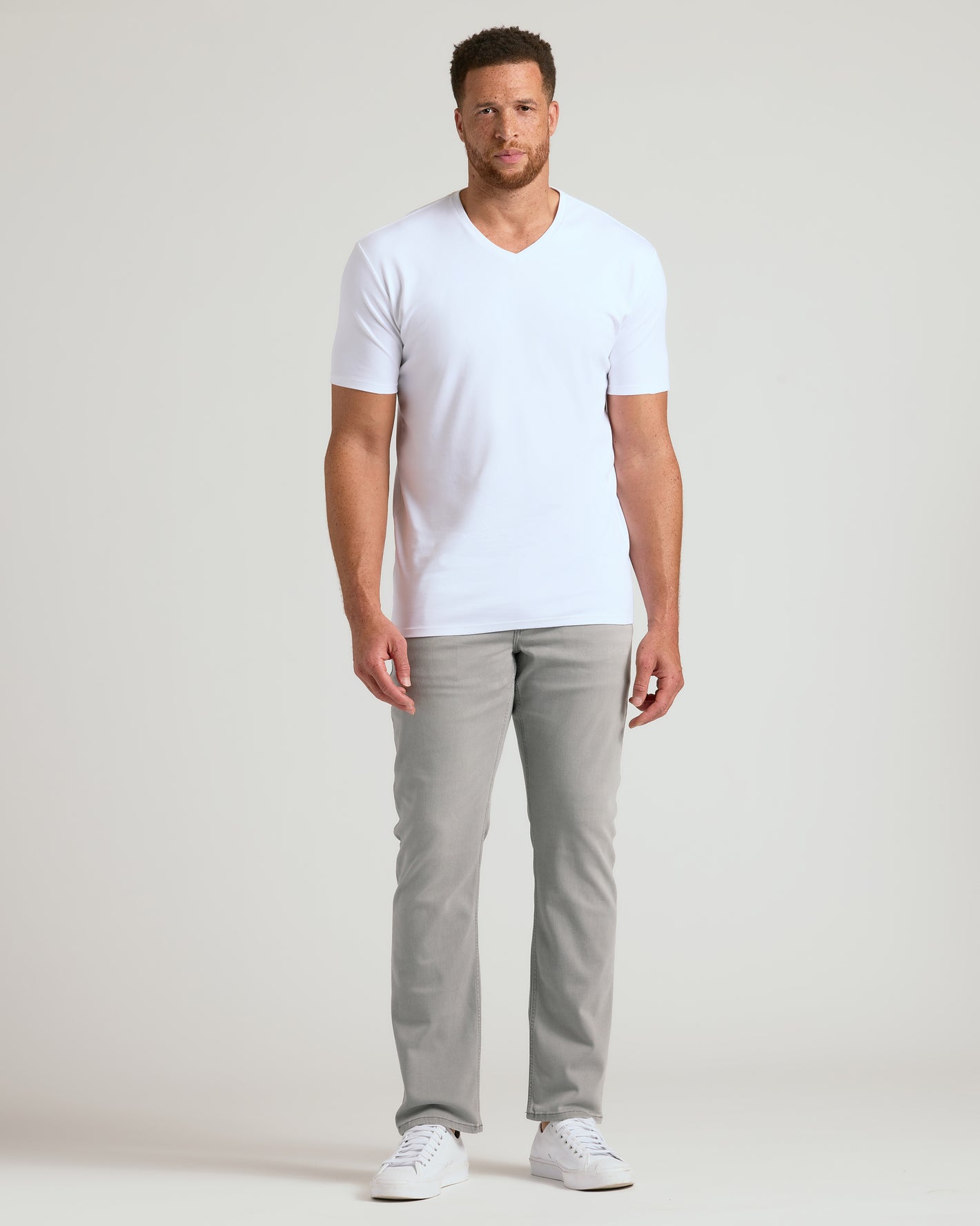Man wearing Black & White Tall Premium Pima V-Neck 4-Pack.