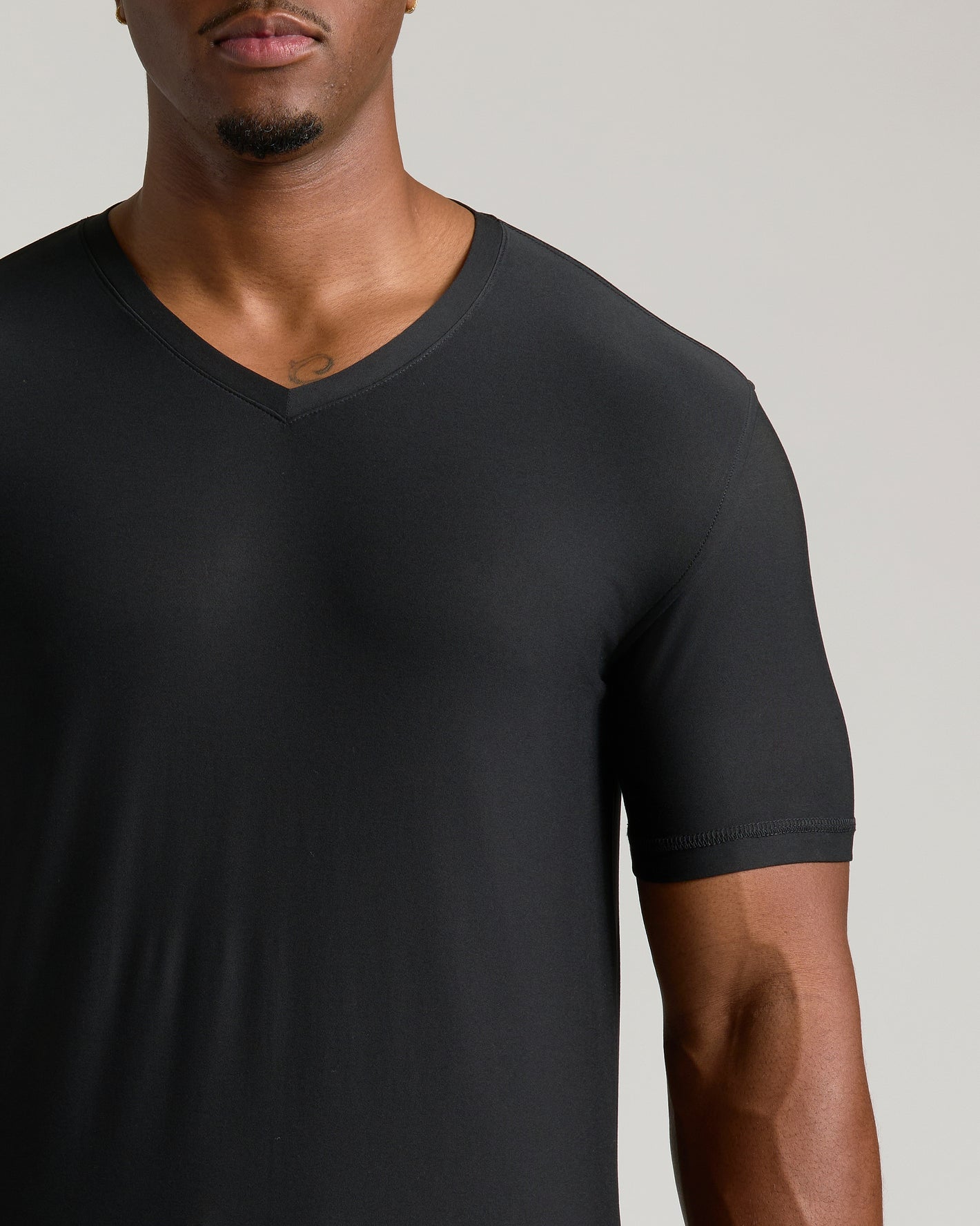 Man wearing Black Tall Active V-Neck shirt.