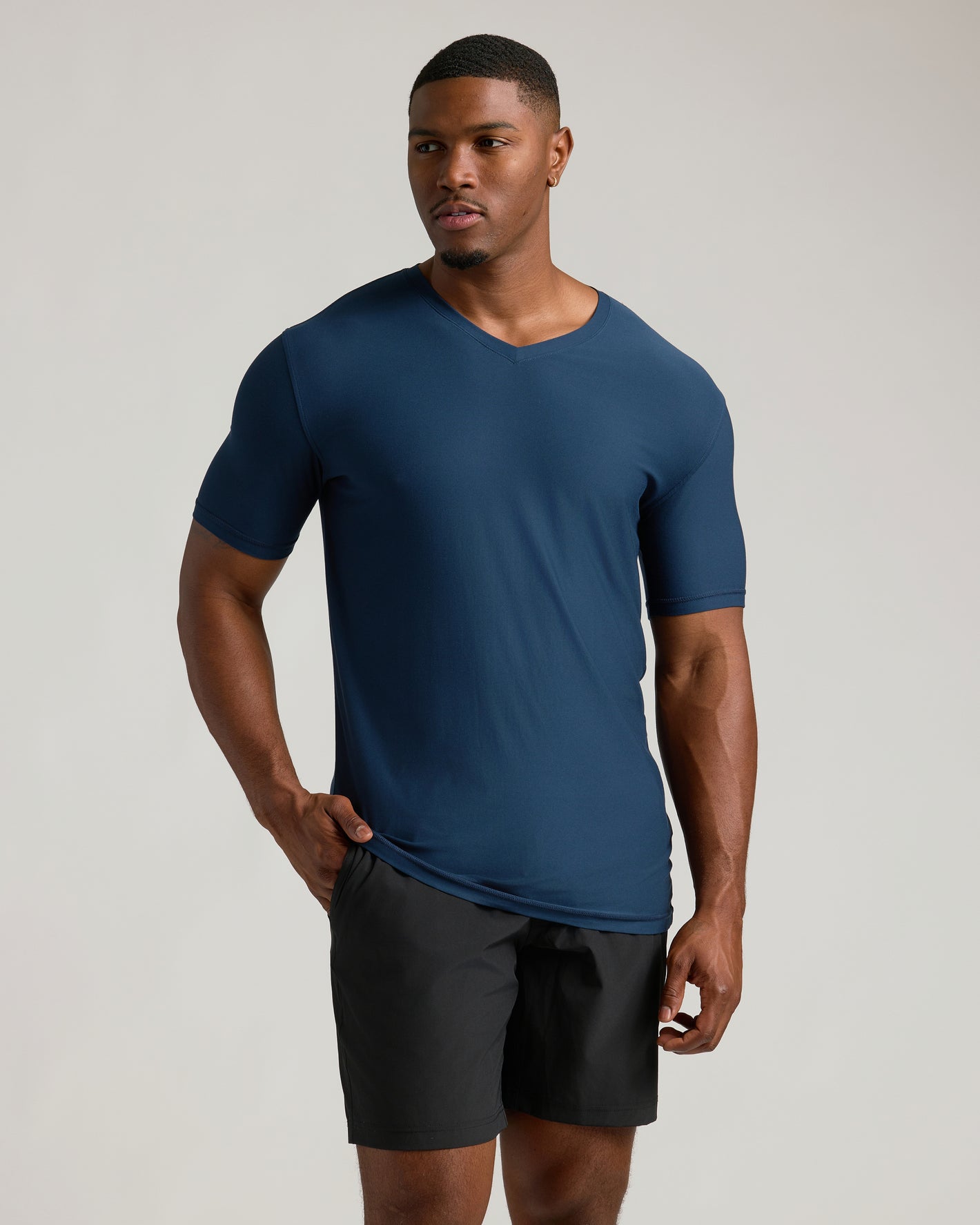 Young man wearing Timeless Tall Active V-Neck, deep blue shade.