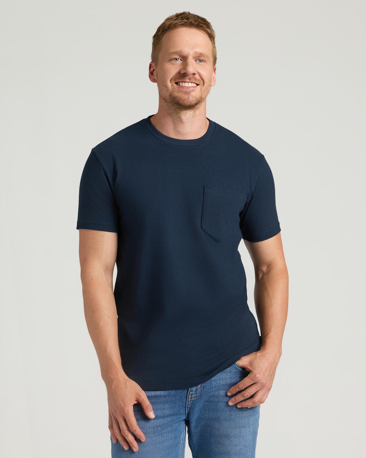 Navy Tall Heavyweight Pocket Crew on smiling man with jeans.