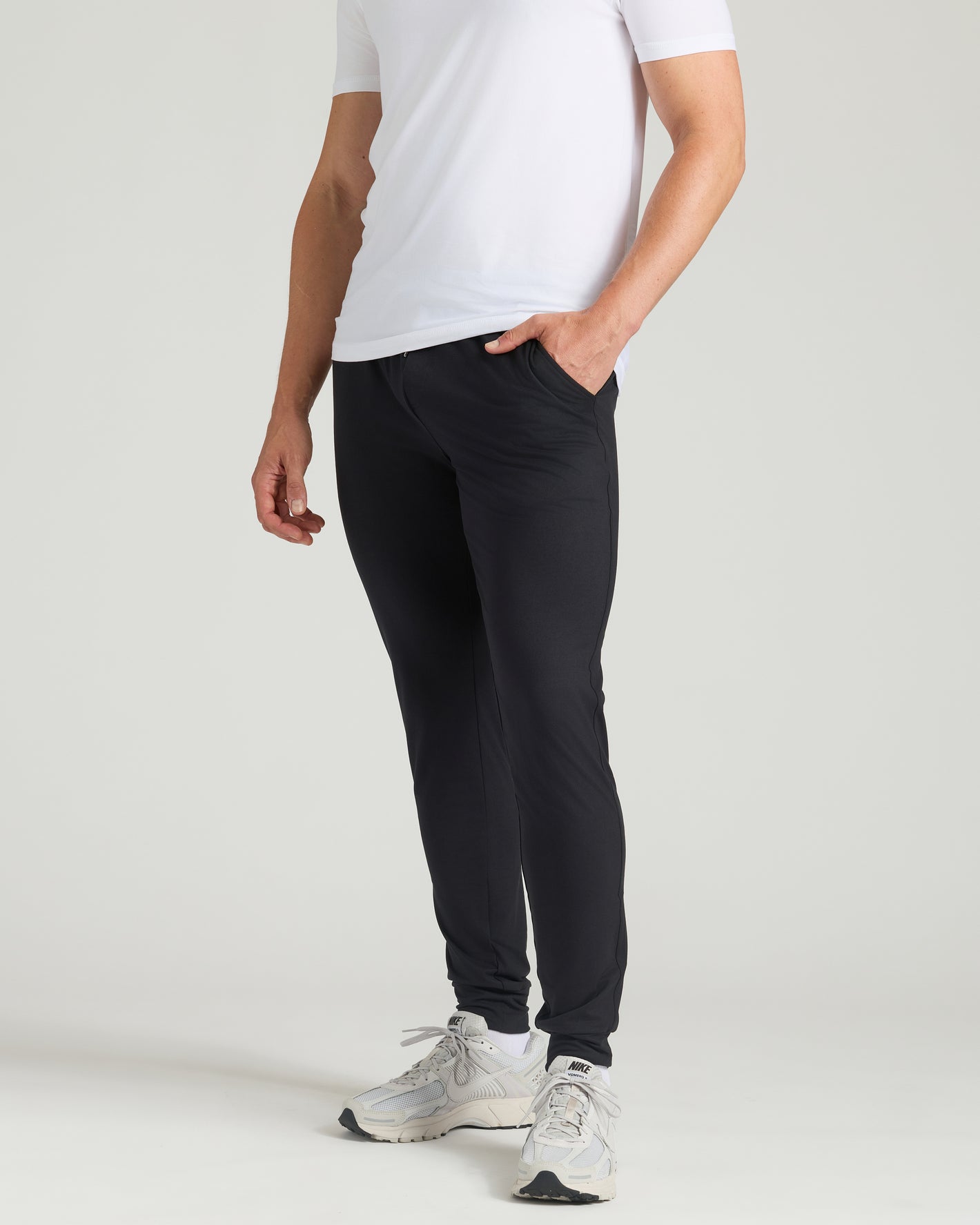 Black Tall Active Joggers with side pockets worn by a standing person.