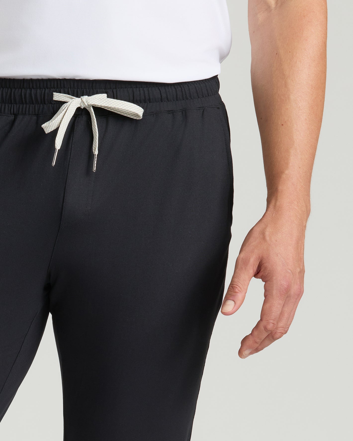 Black Tall Active Joggers with drawstring and elastic waist, right hand visible.