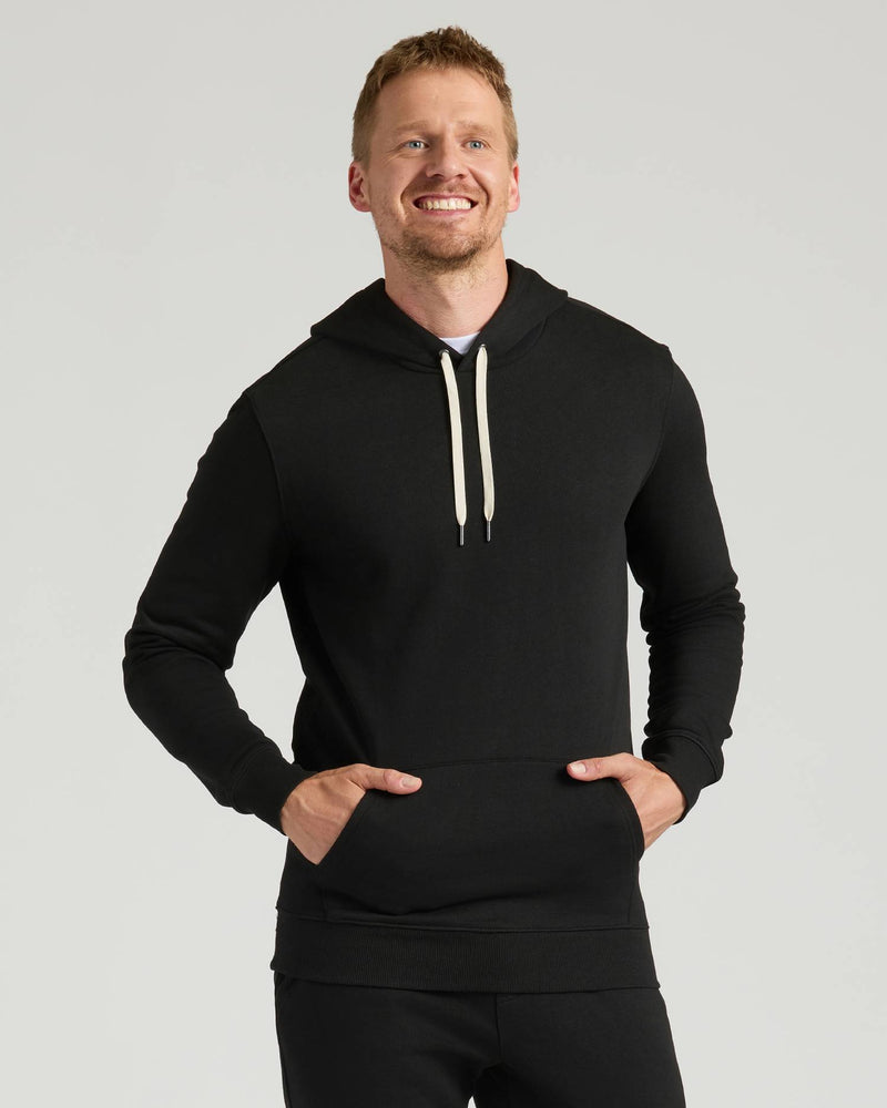 Man wearing Black Tall Fleece Pullover Hoodie from 2-Pack.