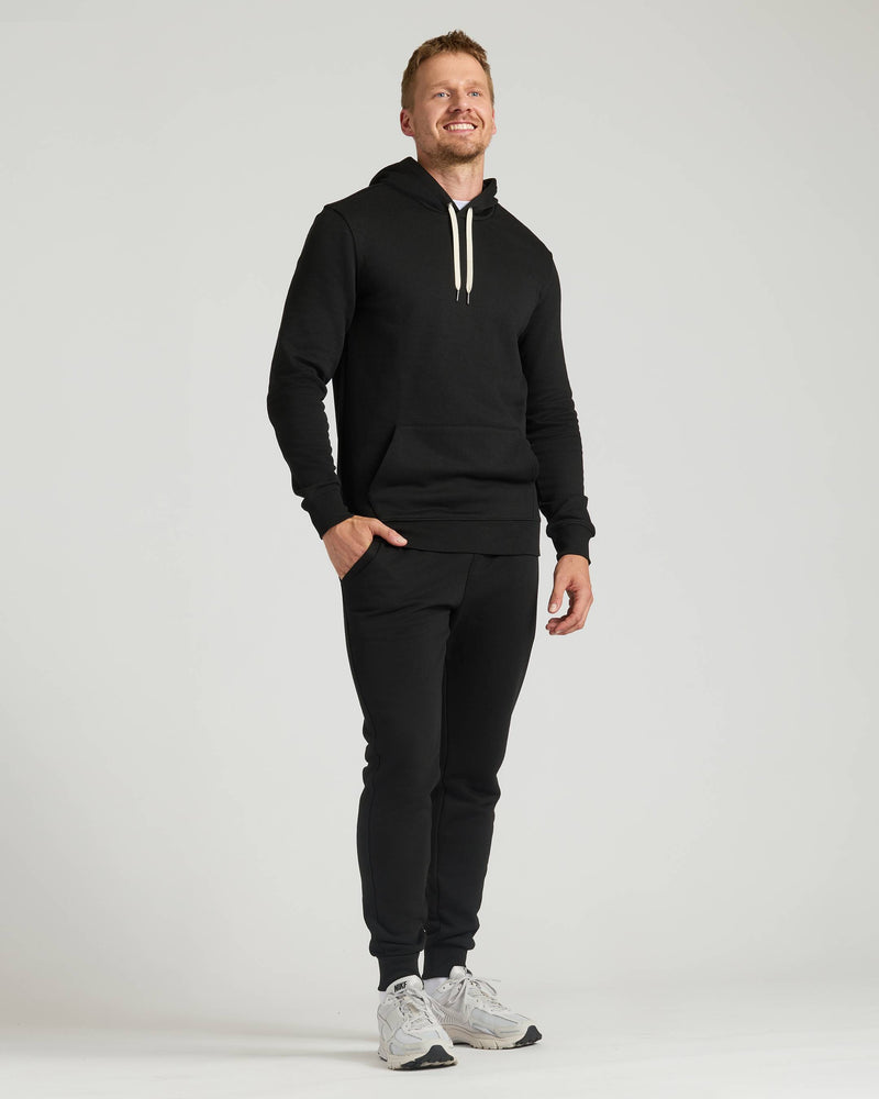 Man wearing Black Tall Fleece Pullover Hoodie & Joggers 2-Pack.