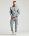Medium Heather Gray Tall Fleece French Terry Pullover Hoodie on man standing.