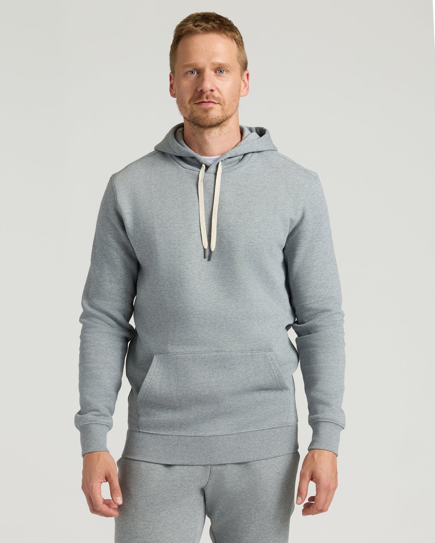 Medium Heather Gray Tall Fleece French Terry Pullover Hoodie on man.