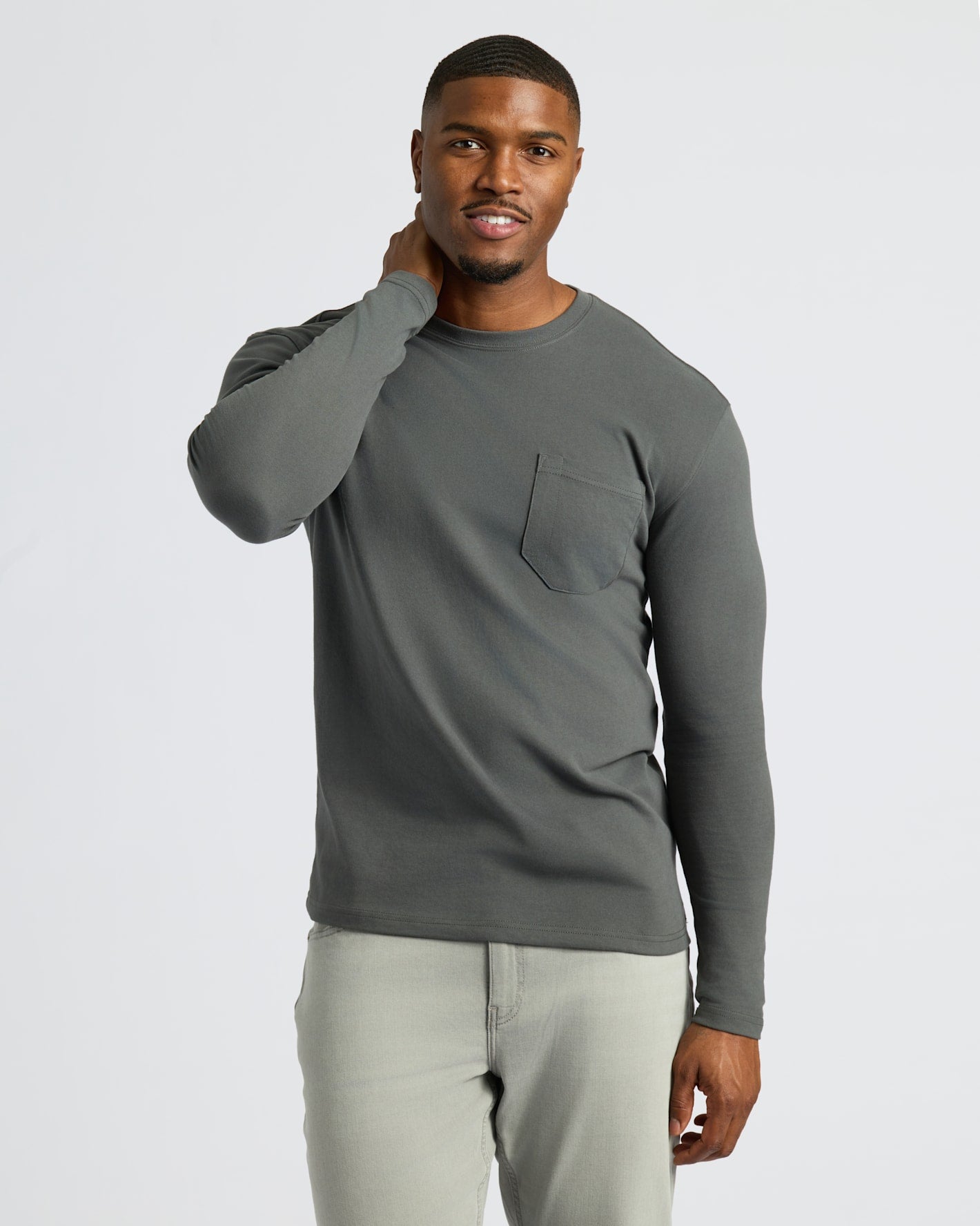 Man wearing Black & Carbon Tall Heavyweight Long Sleeve Pocket Crew, smiling.