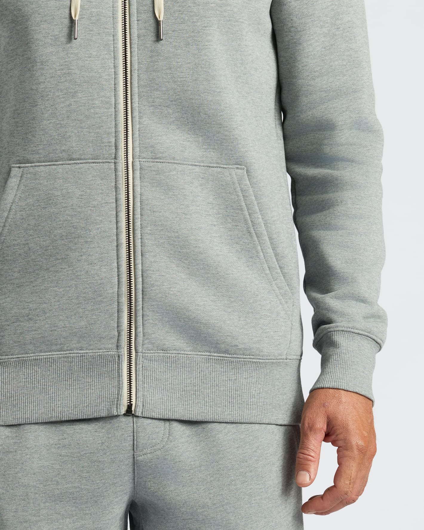 Gray zip-up hoodie with a white background