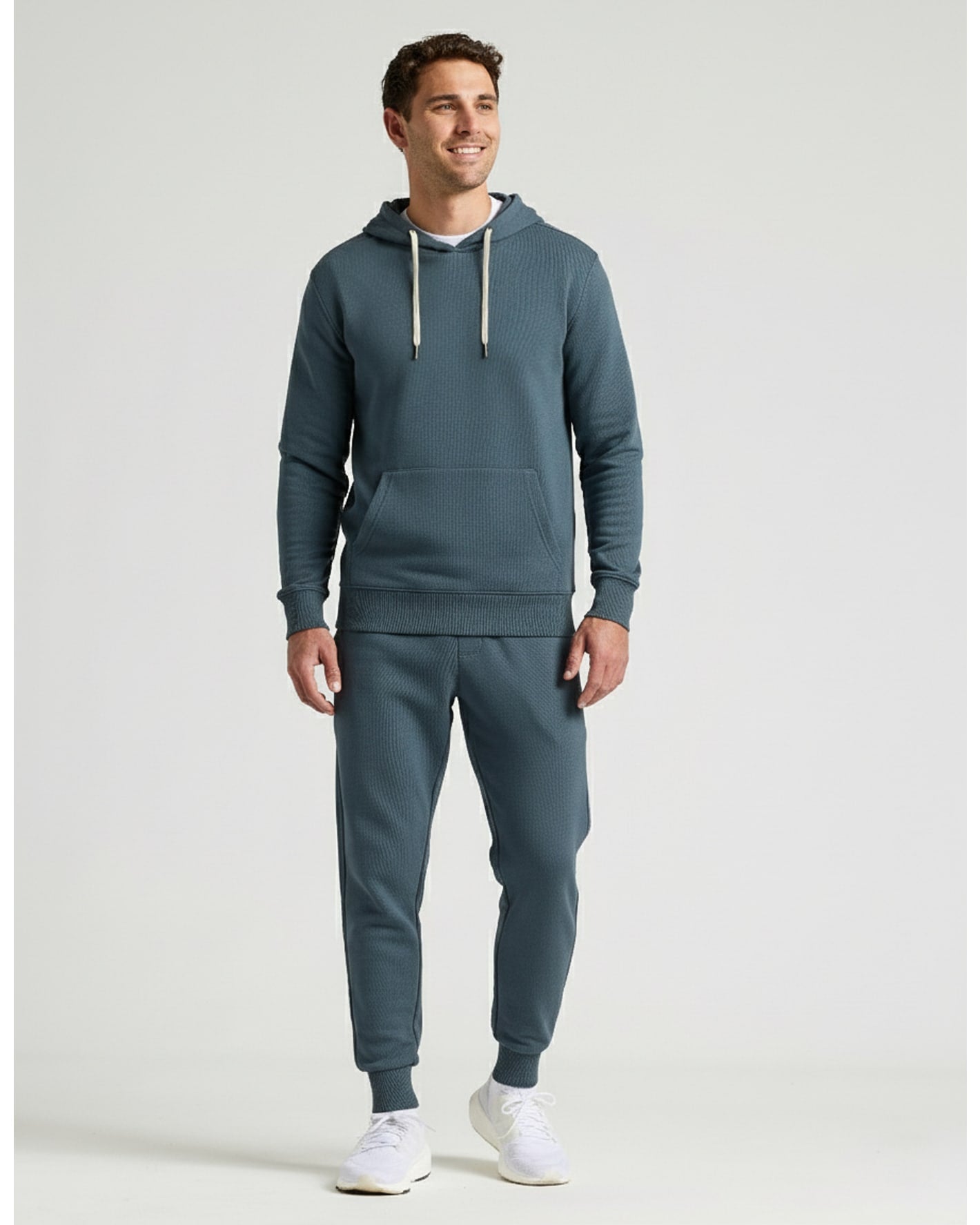 Man modeling Neptune Fleece French Terry Pullover Hoodie with joggers.