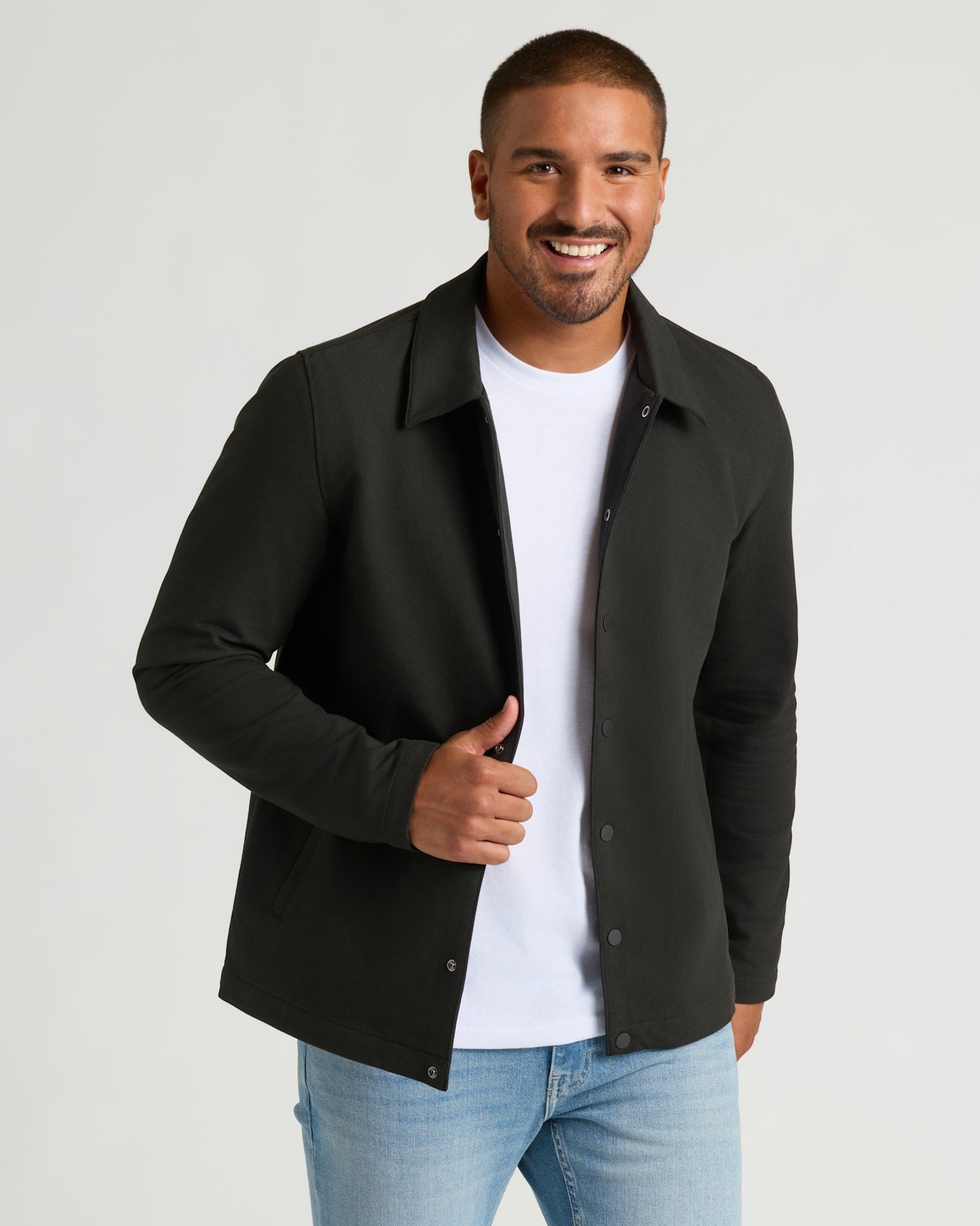 Young man wearing Black Casual Jacket over white T-shirt.