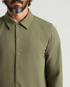 Man wearing Military Green Casual Jacket with snap buttons and pointed collar.