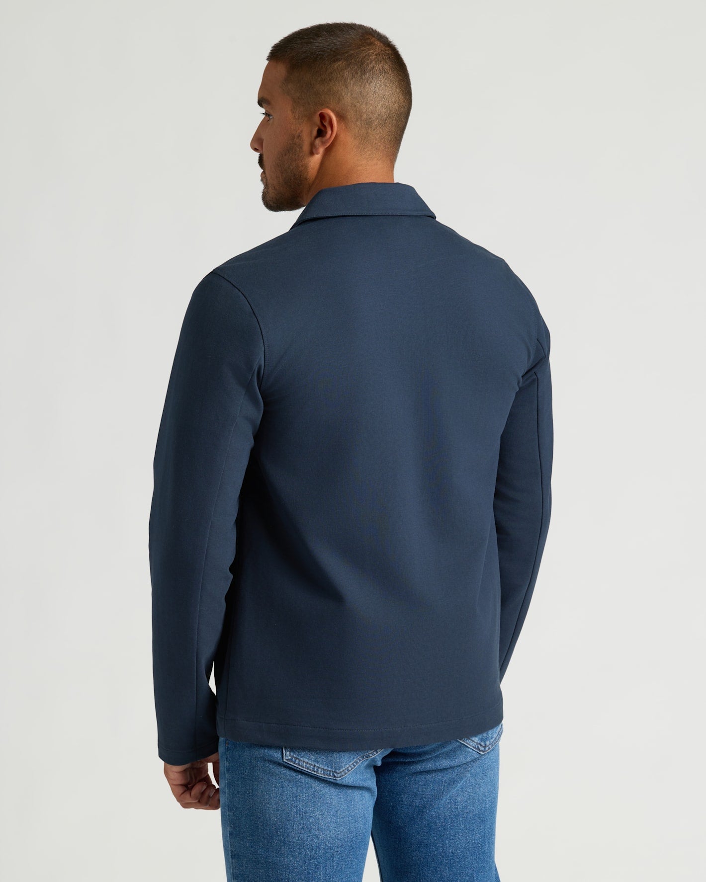 Navy Casual Jacket with long sleeves and a slim fit.