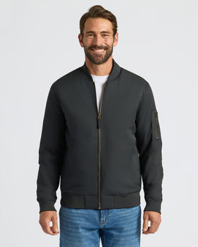 Black Bomber Jacket on man, showcasing its sleek design and fit.