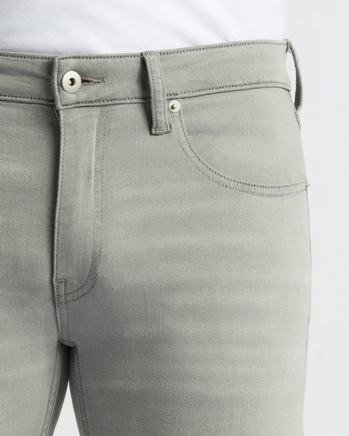 Medium Gray Wash Slim Comfort Stretch Jeans with button closure and belt loops.