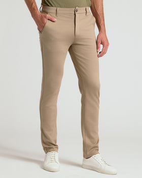 Khaki Suede Brown Slim Comfort Knit Chino modeled with white sneakers.
