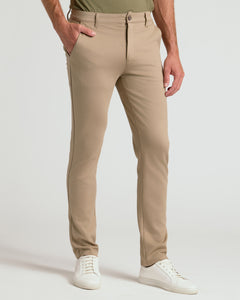 True ClassicNeutral Slim Comfort Knit Chino Pant 3-Pack modeled with white sneakers.