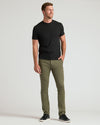 Man in Military Green Slim Comfort Knit Chino Pant, black t-shirt.