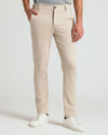 Sandstone Comfort Chino Pants with side pockets and white sneakers.