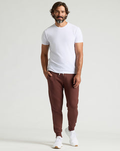 True ClassicMan wearing Carob Fleece French Terry Joggers with white T-shirt and sneakers.