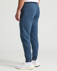 True ClassicFiord Fleece French Terry Joggers with pockets and white sneakers.