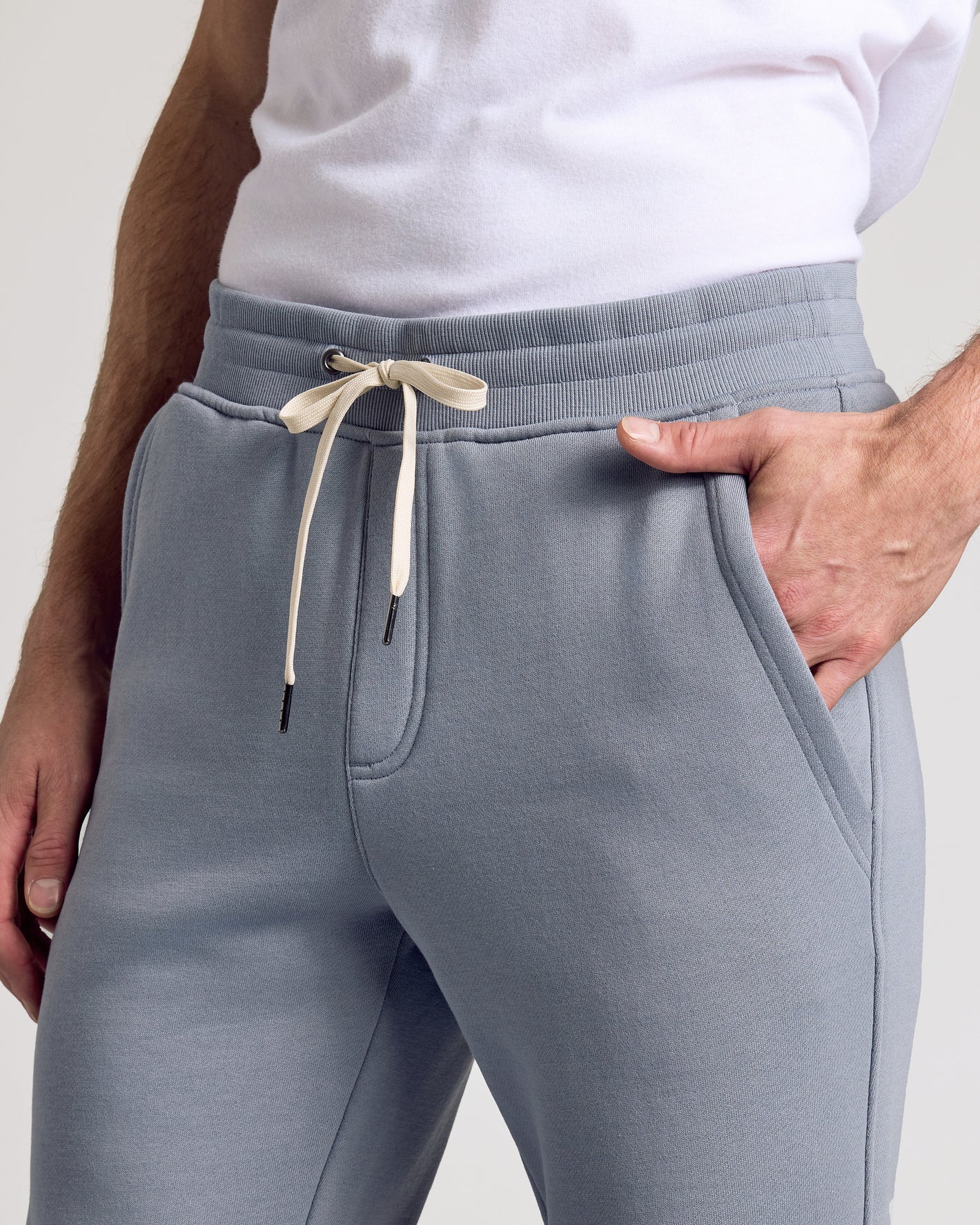 Dusty Blue Fleece French Terry Joggers with off-white drawstring.