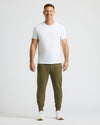 Man in Military Green Fleece French Terry Joggers, white T-shirt.