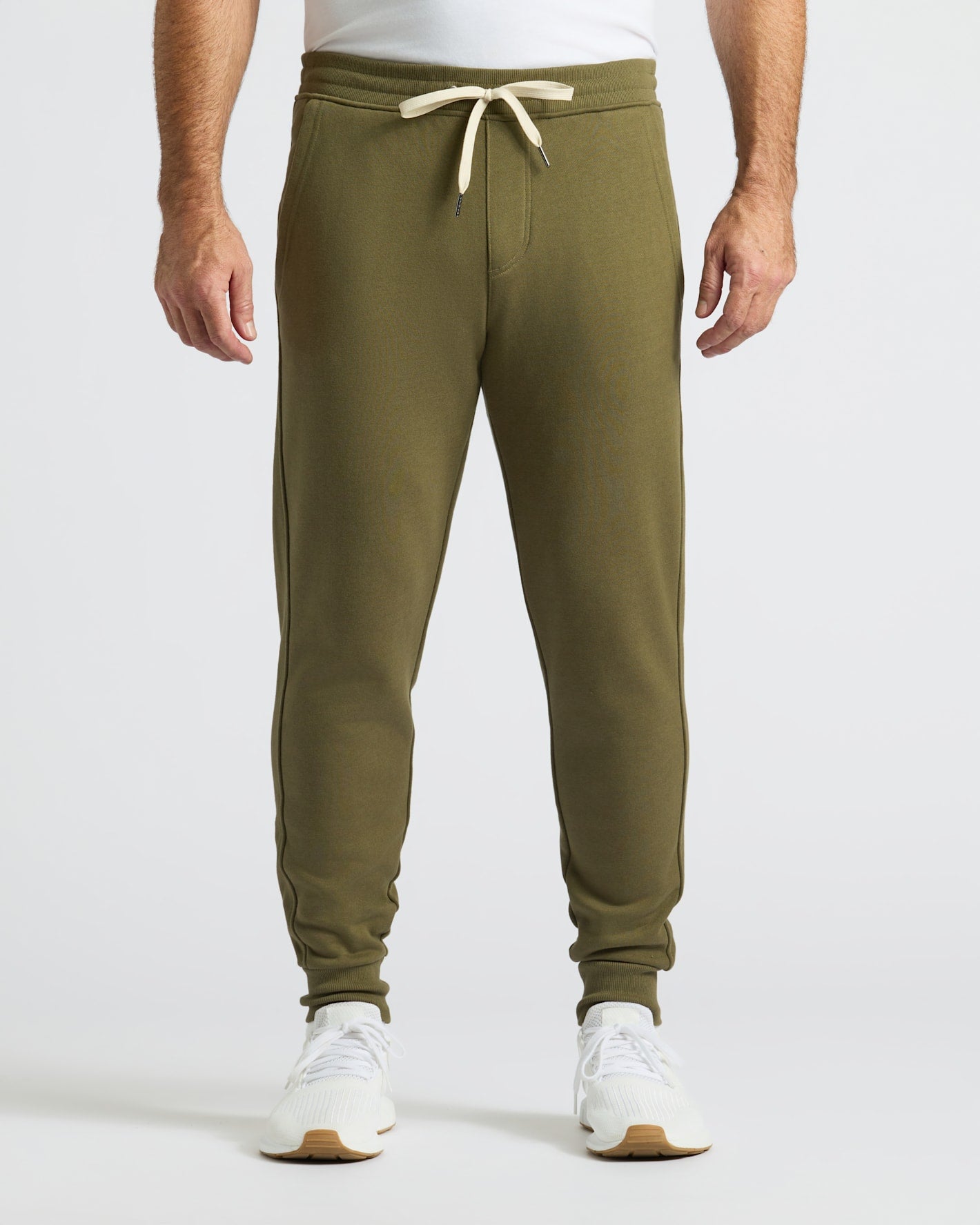 Military Green Fleece French Terry Joggers with white sneakers.