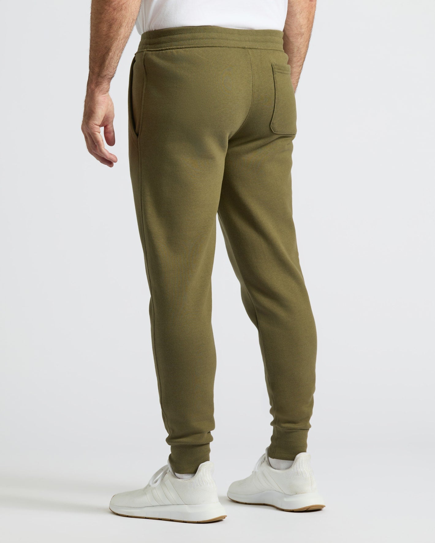 Military Green Fleece French Terry Joggers, back view with white sneakers.