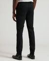 Black Commuter Pants with slim-fit design, paired with black Chelsea boots.