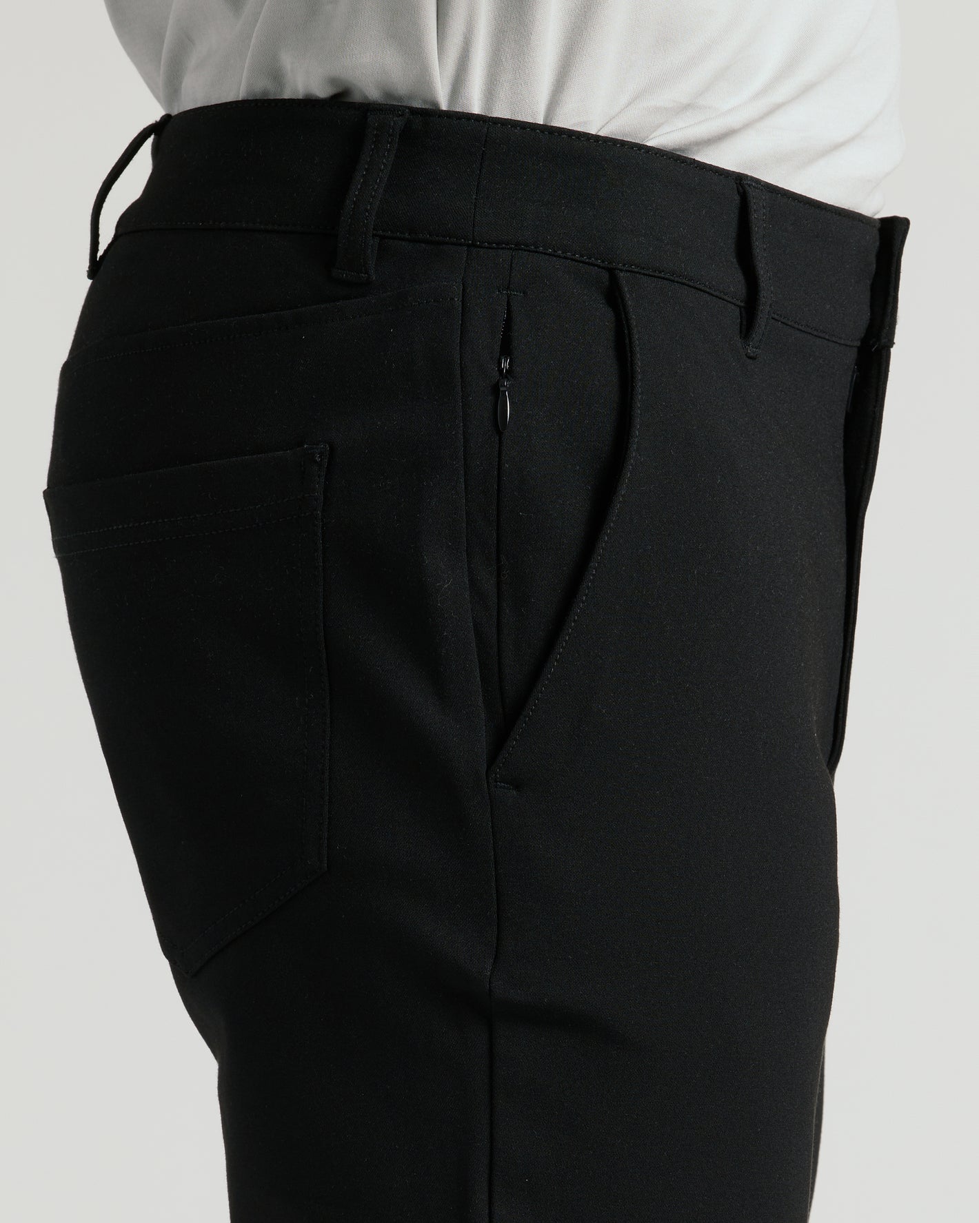 Black Commuter Pants showcasing high-waist, pockets, and tailored fit.