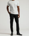 Black Commuter Pants with slim fit, worn with Chelsea boots.