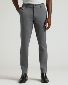 True ClassicCarbon Commuter Pants on model, showcasing slim fit and ankle boots.