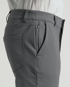 True ClassicCarbon Commuter Pants, side-view showing waistband, zippered side pocket, slash hand pocket.