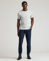 Man wearing Navy Commuter Pants with white T-shirt and Chelsea boots.