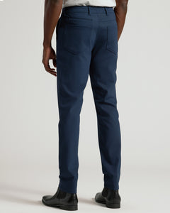 True ClassicNavy Commuter Pants styled with white shirt and Chelsea boots.