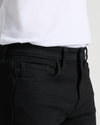 Black Wash Slim Authentic Denim Jeans close-up with front pocket and waistband.