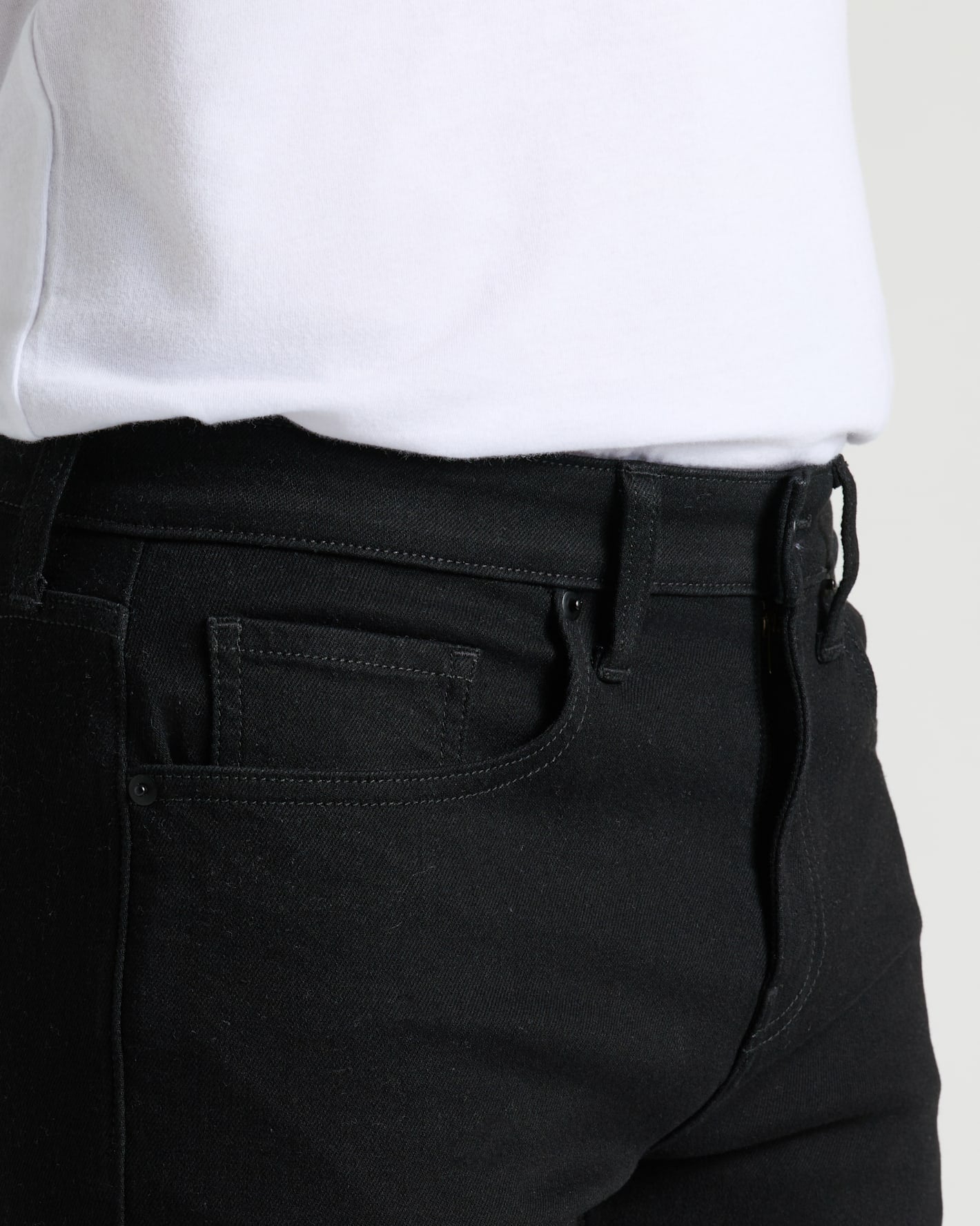 Black Wash Slim Authentic Denim Jeans close-up with front pocket and waistband.