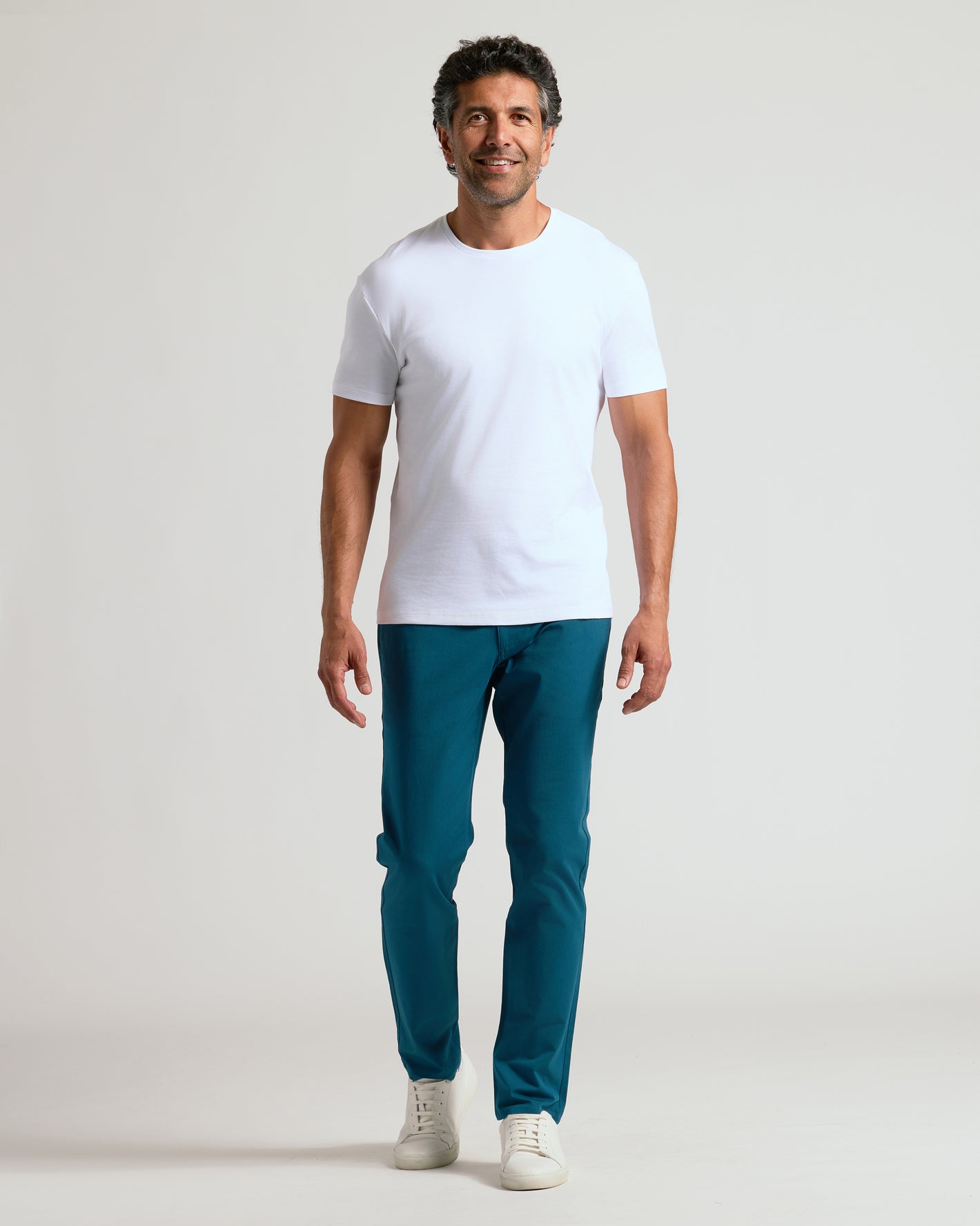 Man wearing Centurion Slim Twill Chino Pant, showcasing stretch and structured fit.